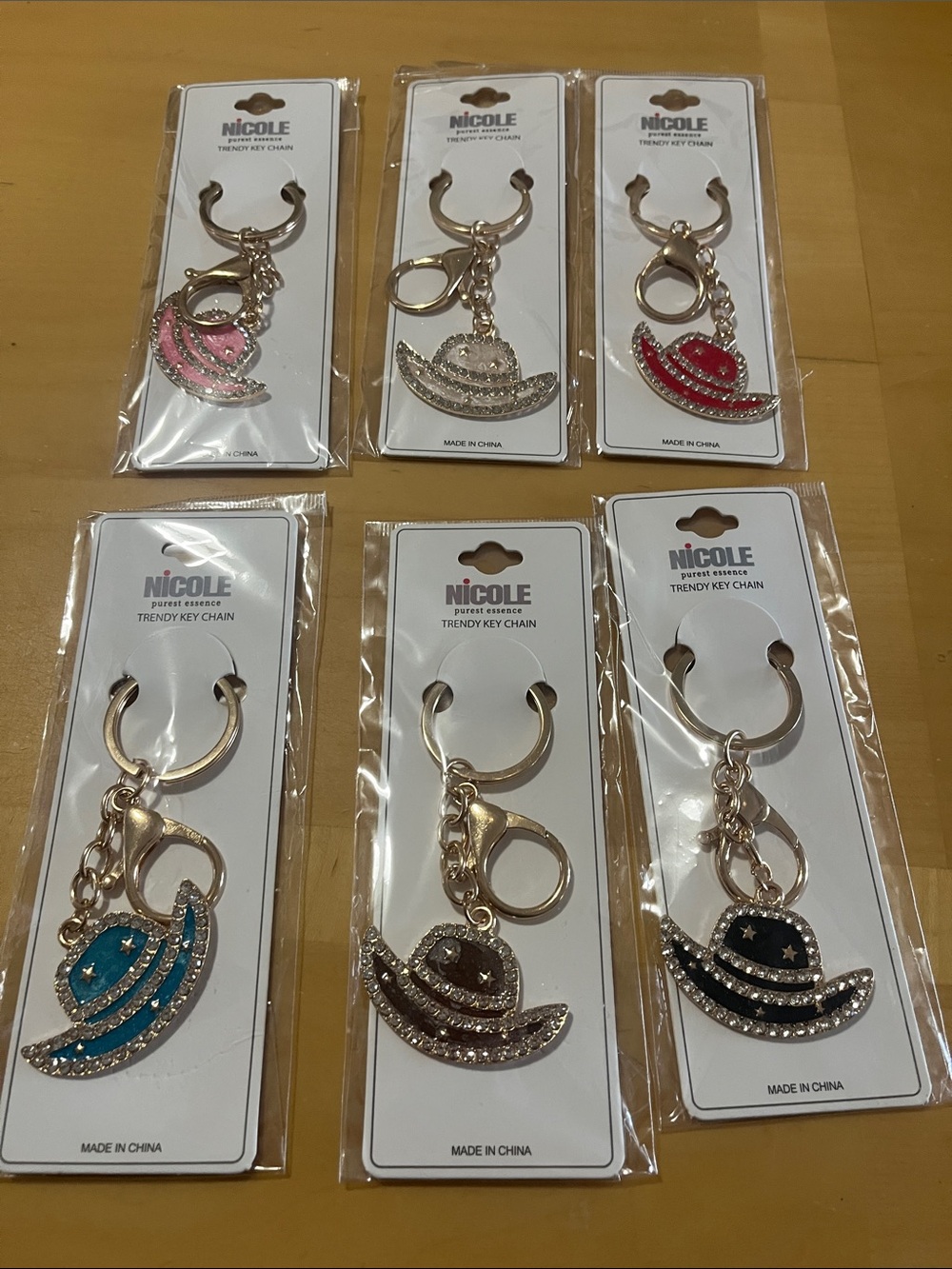 Choice of one Nicole Women's Glitter Cowboy Hat Keychain - Assorted Colors
